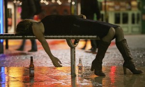BRISTOL, ENGLAND - OCTOBER 15: A woman lies on a bench after leaving a bar in Bristol City Centre on October 15, 2005 in Bristol, England. Pubs and clubs are preparing for the new Licensing laws due to come into force on November 24 2005, which will allow pubs and clubs longer and more flexible opening hours. Opponents of the law believe this will lead to more binge-drinking with increased alcohol related crime, violence and disorder while health experts fear an increase in alcohol related illnesses and alcoholism. (Photo by Matt Cardy/Getty Images)